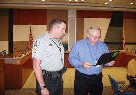 TPA’s Sgt. Cameron receives Safety Award from Superintendent of Operations, Larry Bagby, of Tampa Port Authority.